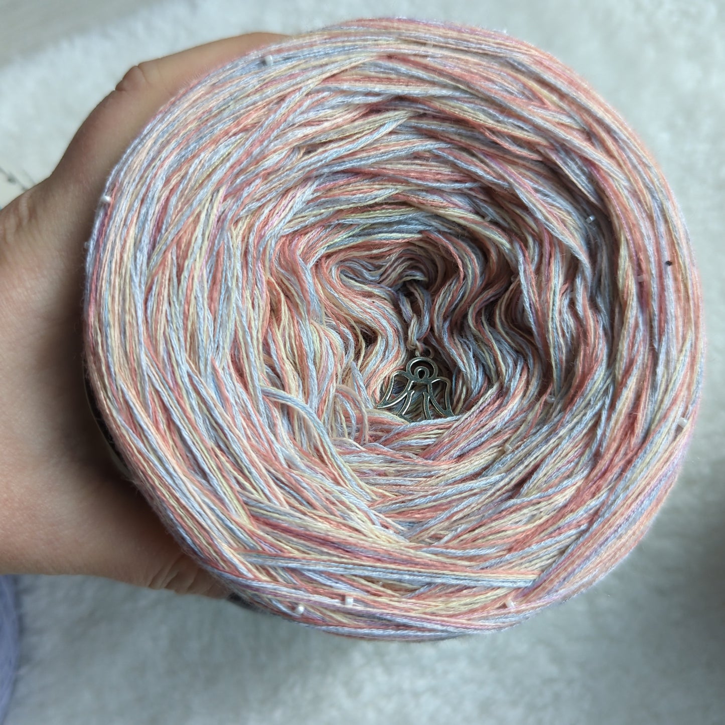 M052 merino/acrylic melange yarn cake, 260g, about 700m, 3ply plus two additional threads