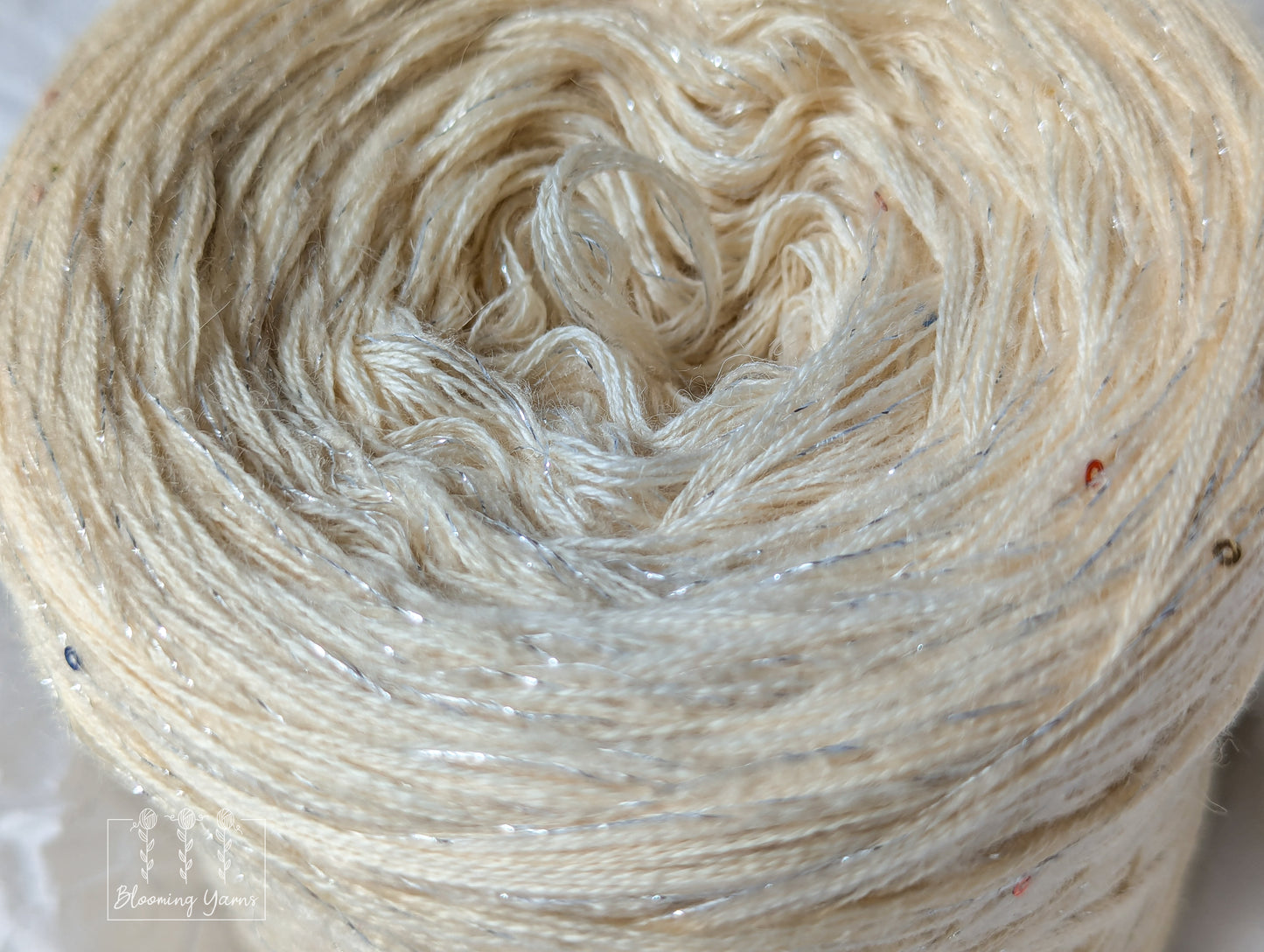 Cotton/merino yarn cake with additional mohair thread with lurex and sequins CMW020